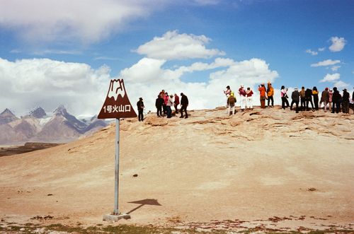 Chinese tourists at a volcanic crater, Tashkurgan, Xinjiang, China