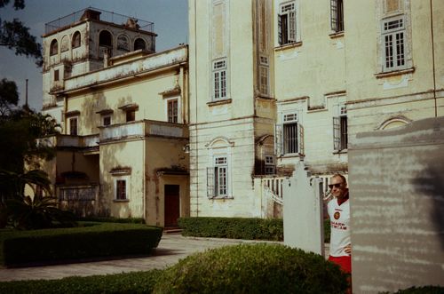 Man in between buildings in Kaiping, Guangdong, China