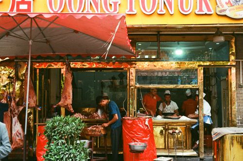 Baked samosa operation, from pig (left) to bun (right), Shache, Xinjiang, China