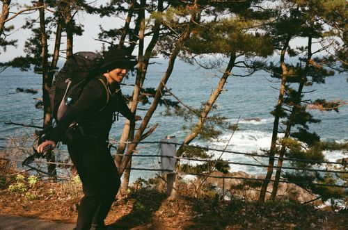 Man attempting flight, Michinoku Hiking Trail on the way to Taneishi, Japan