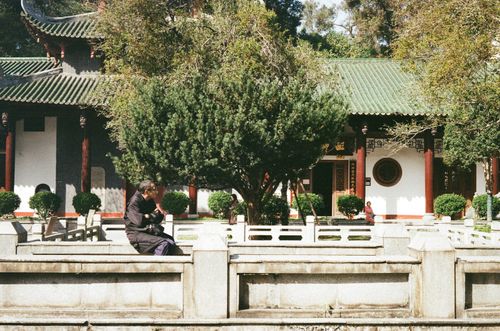 Nanhua Temple man taking a break, Shaoguan, Guangdong Province, China