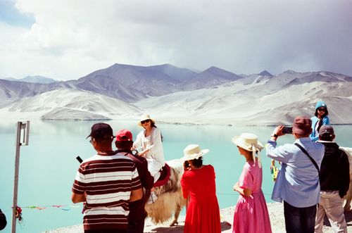 Influencers on a yak, Baisha Lake, Tashkurgan, Xinjiang, China